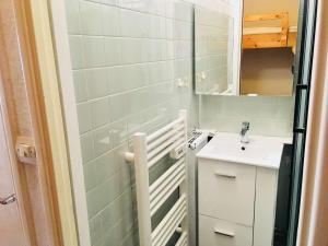 a small bathroom with a sink and a mirror at Studio Gourette, 1 pièce, 4 personnes - FR-1-400-53 in Gourette