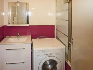 a small bathroom with a washing machine and a sink at Studio Les Orres, 1 pièce, 4 personnes - FR-1-322-319 in Les Orres