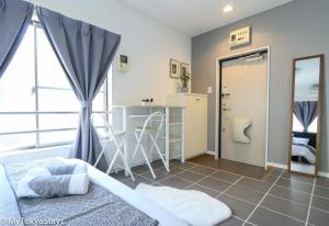 a bedroom with a bed and a kitchen and a bathroom at NEW Heart of Shibuya Prime Studio, Kamiyama Inn! in Tokyo