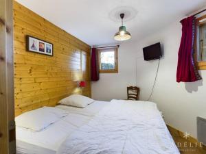 Appartement Montvalezan-La Rosière, 3 pièces, 6 personnes - FR-1-398-523にあるベッド