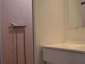 a bathroom with a toilet and a sink and a mirror at Maison Saint-Cyprien, 3 pièces, 8 personnes - FR-1-225D-616 in Saint-Cyprien-Plage