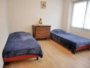 En eller flere senge i et værelse på Appartement Carnac, 3 pièces, 4 personnes - FR-1-477-130