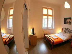 Posteľ alebo postele v izbe v ubytovaní VisitKrak