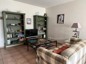 a living room with a couch and a coffee table at Appartement Cambo-les-Bains, 3 pièces, 4 personnes - FR-1-495-20 in Cambo-les-Bains