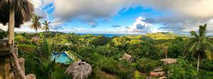 a view of the ocean from a resort at Tropical Cottage En Eco Casa Algana in El Limón