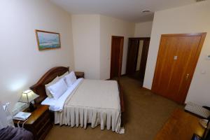 Een bed of bedden in een kamer bij Residence Park Hotel