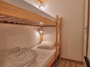 a bedroom with two bunk beds in a room at Studio Notre-Dame-de-Bellecombe, 1 pièce, 2 personnes - FR-1-505-19 in Notre-Dame-de-Bellecombe