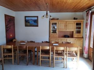 a dining room with a wooden table and chairs at Chalet Arêches-Beaufort, 6 pièces, 12 personnes - FR-1-342-198 in Arêches