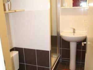a small bathroom with a sink and a toilet at Appartement Les Adrets-Prapoutel, 1 pièce, 3 personnes - FR-1-557-10 in Les Adrets