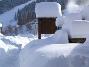 a bunch of snow piled up on a yard at Charmant 2 pièces au pied des pistes avec balcon et casier à skis - FR-1-557-59 in Les Adrets