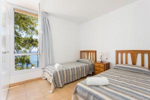 Ένα ή περισσότερα κρεβάτια σε δωμάτιο στο Luxury Villa in front of the beach POPETA +18 φωτογραφίες