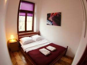Posteľ alebo postele v izbe v ubytovaní VisitKrak