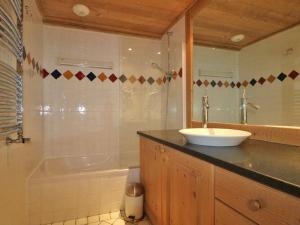 a bathroom with a sink and a shower and a tub at Appartement Montvalezan-La Rosière, 3 pièces, 4 personnes - FR-1-398-624 in Montvalezan