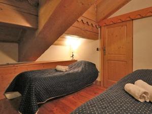 a bedroom with two beds in a attic at Appartement Montvalezan-La Rosière, 3 pièces, 4 personnes - FR-1-398-624 in Montvalezan