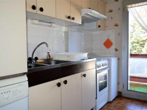 a kitchen with a sink and a stove at Appartement Font-Romeu-Odeillo-Via, 3 pièces, 6 personnes - FR-1-580-34 in Font Romeu Odeillo Via
