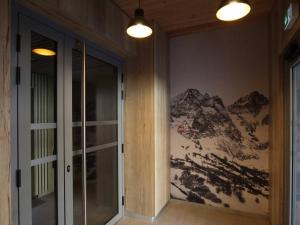 a hallway with a mountain mural on the wall at Appartement 3 étoiles, 42m², terrasse ensoleillée, 4 pers., Briançon - FR-1-330C-115 in Briançon