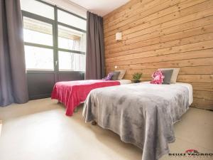 Krevet ili kreveti u jedinici u okviru objekta Appartement Saint-Lary-Soulan, 3 pièces, 6 personnes - FR-1-296-328