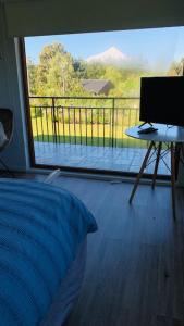 TV a/nebo společenská místnost v ubytování Casa Familiar Puerto Varas
