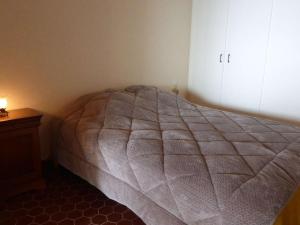 a bedroom with a bed and a dresser at Appartement spacieux 1er étage avec balcon, vue mer, double garage à Saint-Gilles-Croix-de-Vie - FR-1-224-775 in Saint-Gilles-Croix-de-Vie