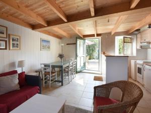 a living room with a couch and a table at Maison de Charme avec Cour, 2 Chambres, Cuisine Équipée, Proche Village St Clément des Baleines - FR-1-434-74 in Saint-Clément-des-Baleines