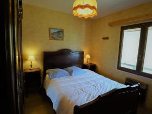 a bedroom with a large bed with white sheets at Chalet Arêches-Beaufort, 4 pièces, 7 personnes - FR-1-342-234 in Beaufort