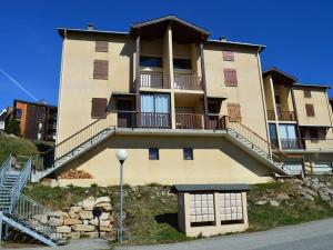 a large apartment building with a balcony on a hill at Appartement Les Angles, 2 pièces, 4 personnes - FR-1-593-1 in Les Angles