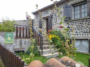 a stone house with stairs leading to a door at Gîte Saint-Haon, 4 pièces, 5 personnes - FR-1-582-211 in Saint-Haon