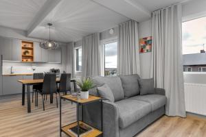 a living room with a couch and a table at B20 Apartments in Reykjavík