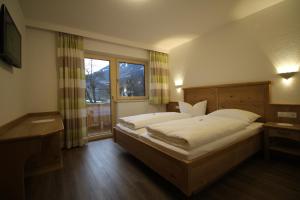 מיטה או מיטות בחדר ב-Apart Geisler