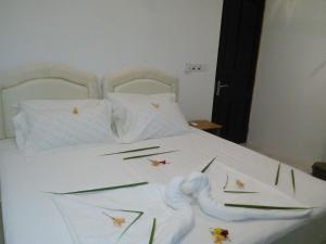 Letto o letti in una camera di Maafushi View