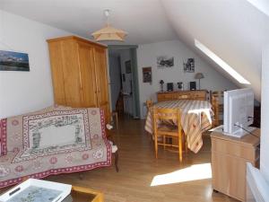 a living room with a bed and a dining room at Luchon - Duplex 6 pers, Balcon Sud, Parking, Animaux admis - FR-1-313-161 in Luchon