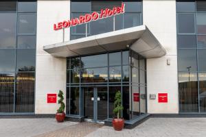 a building with a sign on the front of it at Leonardo Hotel Derby in Derby