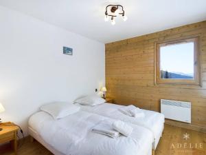 Katil atau katil-katil dalam bilik di Appartement Montvalezan-La Rosière, 3 pièces, 4 personnes - FR-1-398-638