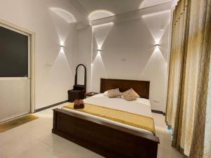 A bed or beds in a room at White Fortress