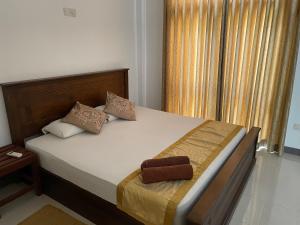 A bed or beds in a room at White Fortress