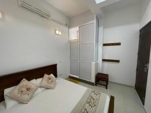 A bed or beds in a room at White Fortress