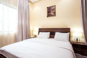 Postel nebo postele na pokoji v ubytování Rushmore - Premier 1 Room