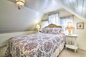 a bedroom with a bed and two lamps and a window at Historical Portland Home Less Than 2 Mi to Downtown! in Portland