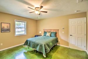 a bedroom with a bed and a ceiling fan at Brand New Cotter Home, Walk to Trout Fishing! in Cotter