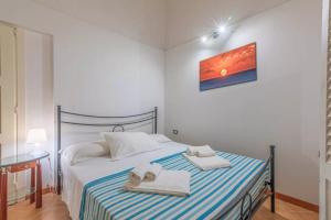Postel nebo postele na pokoji v ubytování A'Storia