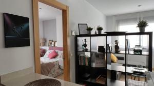Televízia a/alebo spoločenská miestnosť v ubytovaní Love Rent4 Málaga Pacifico