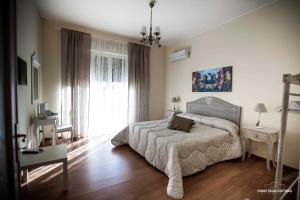 A bed or beds in a room at Ciuri Ciuri B&B