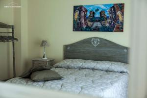 A bed or beds in a room at Ciuri Ciuri B&B