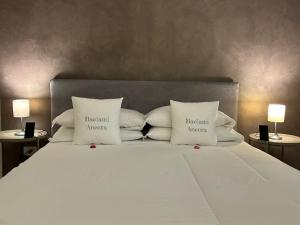 Cama ou camas em um quarto em B&B Baciami Ancora