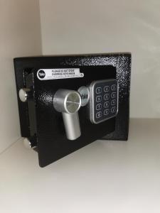 a safe with a remote control in a wall at Residenze Niguarda E in Milan