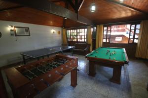 an overhead view of a room with a pool table at Pousada do Marujo in Rio das Ostras