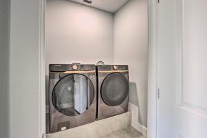 a washer and dryer in a laundry room at Stunning Laguna Vista Retreat with Pool and Grill in Laguna Vista