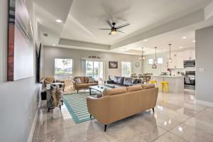 a living room with couches and a kitchen at Stunning Laguna Vista Retreat with Pool and Grill in Laguna Vista