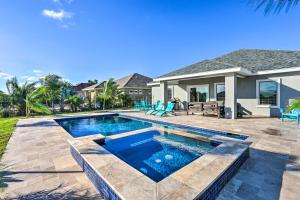a swimming pool in the backyard of a house at Stunning Laguna Vista Retreat with Pool and Grill in Laguna Vista