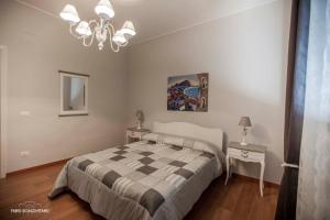 A bed or beds in a room at Ciuri Ciuri B&B